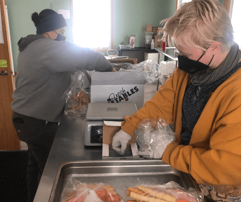 people bagging produce