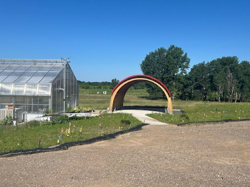 the pavilion by the farm building on a sunny day