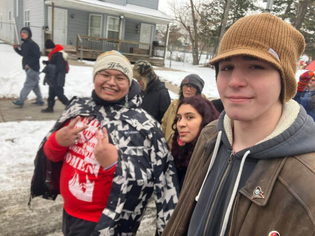 kids smiling outside in the winter